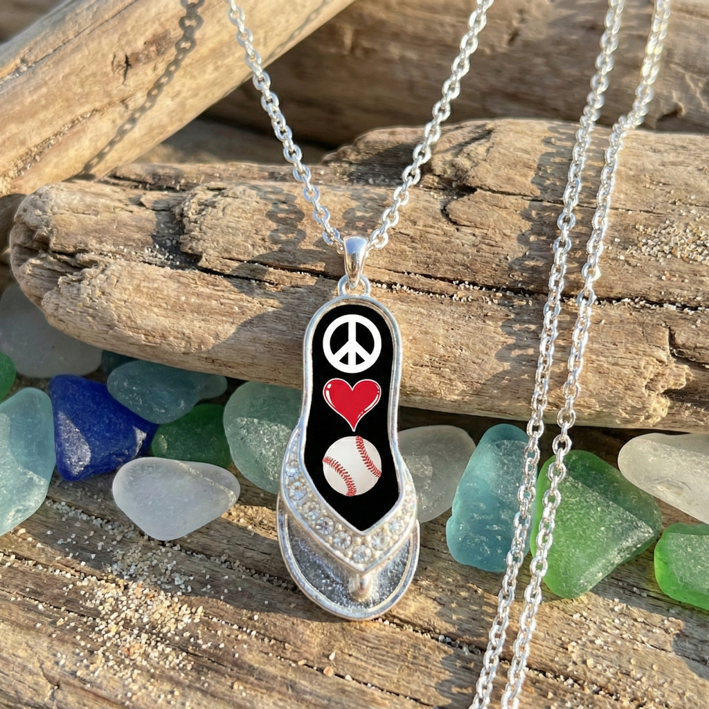 peace love baseball flip flop necklace near the beach displayed on wood with colorful sea glass. 