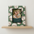 Framed photo of a woman and child on a decorative Prinz frame with baseball pattern