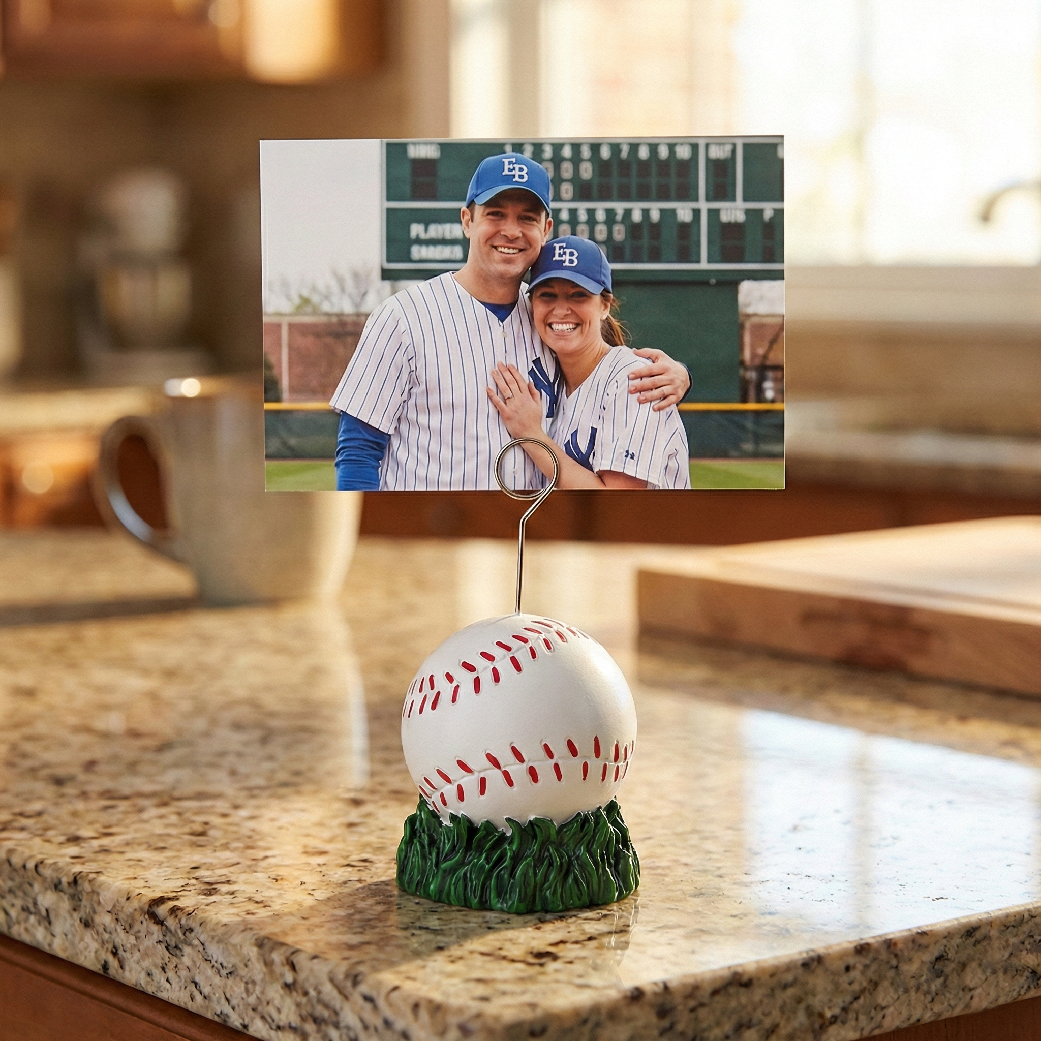 Baseball-themed photo holder with a couple in sports jerseys on a kitchen counter.