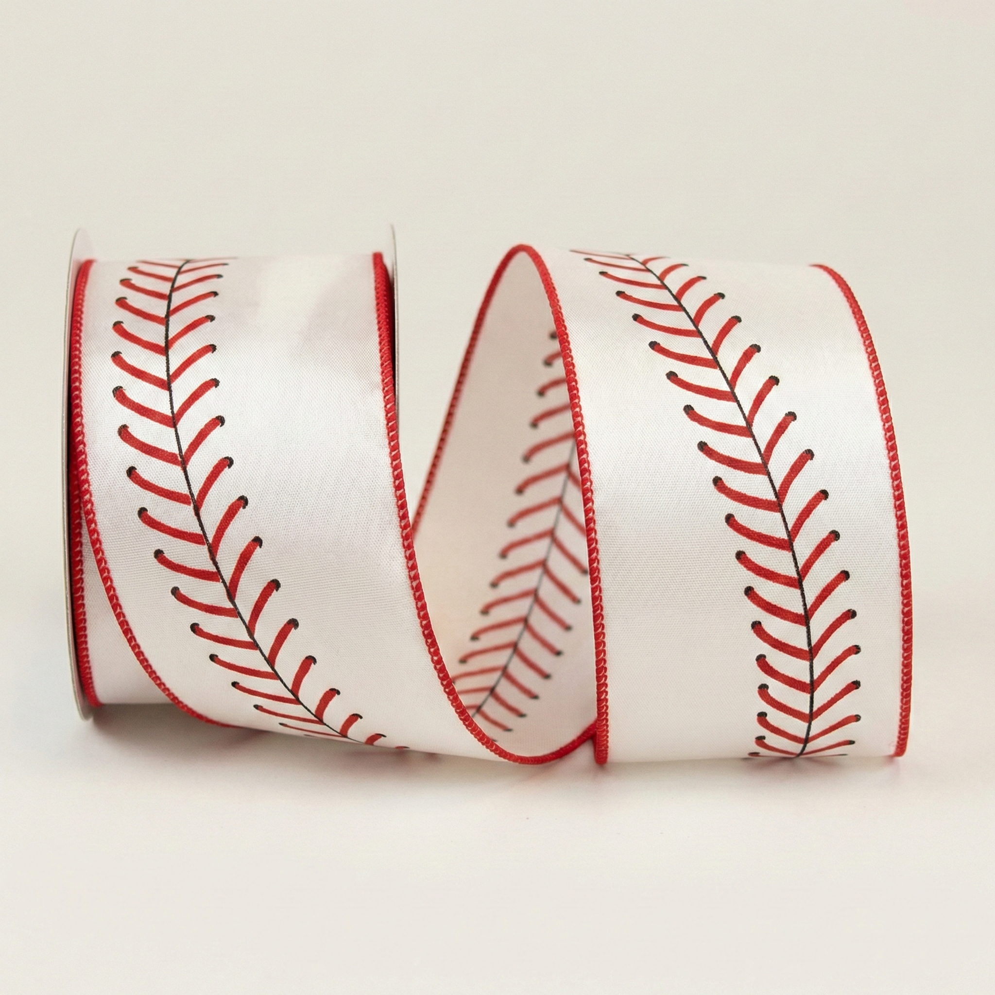 White ribbon with red baseball seams pattern on a white background