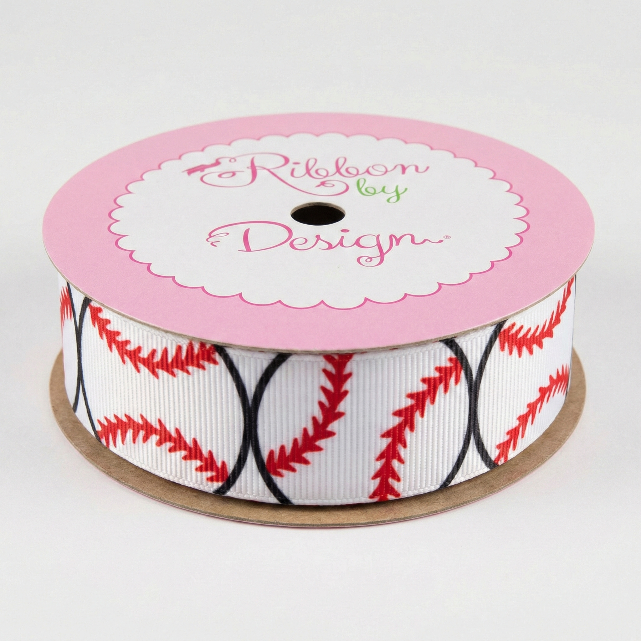 Spool of ribbon with baseball pattern on a white background