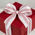 Red gift box with a white ribbon featuring red baseball stitching on a light gray background