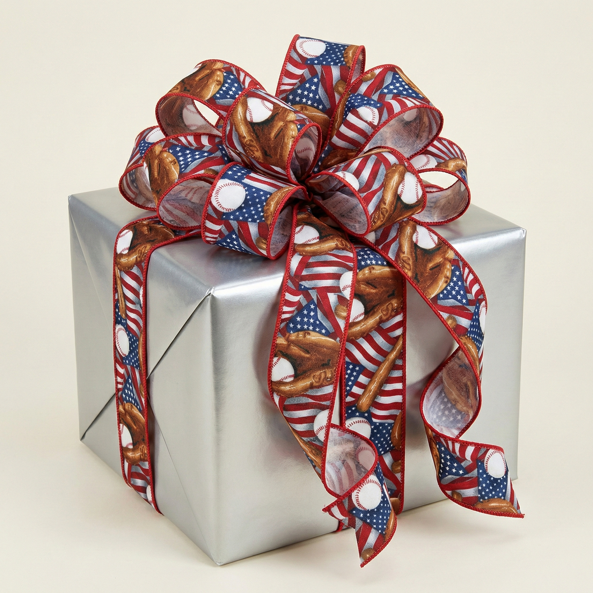 Gift box wrapped with a ribbon featuring baseball-themed USA American Flag design on a beige background