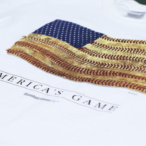 Close-up of a white shirt with an American flag design and 'America's Game' text.