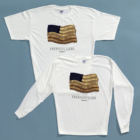 White t-shirt and long-sleeve shirt with 'America's Game' graphic on a gray background