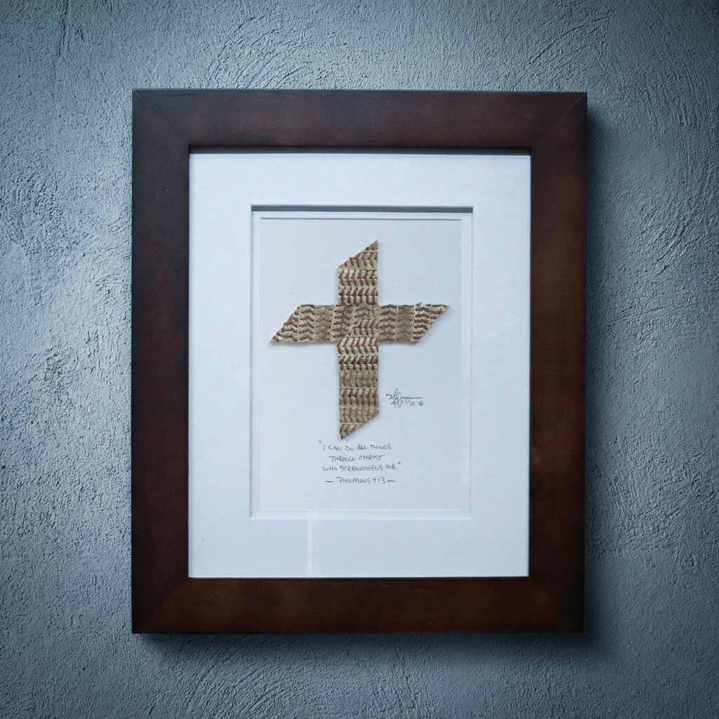 Framed baseball cross artwork on a textured wall