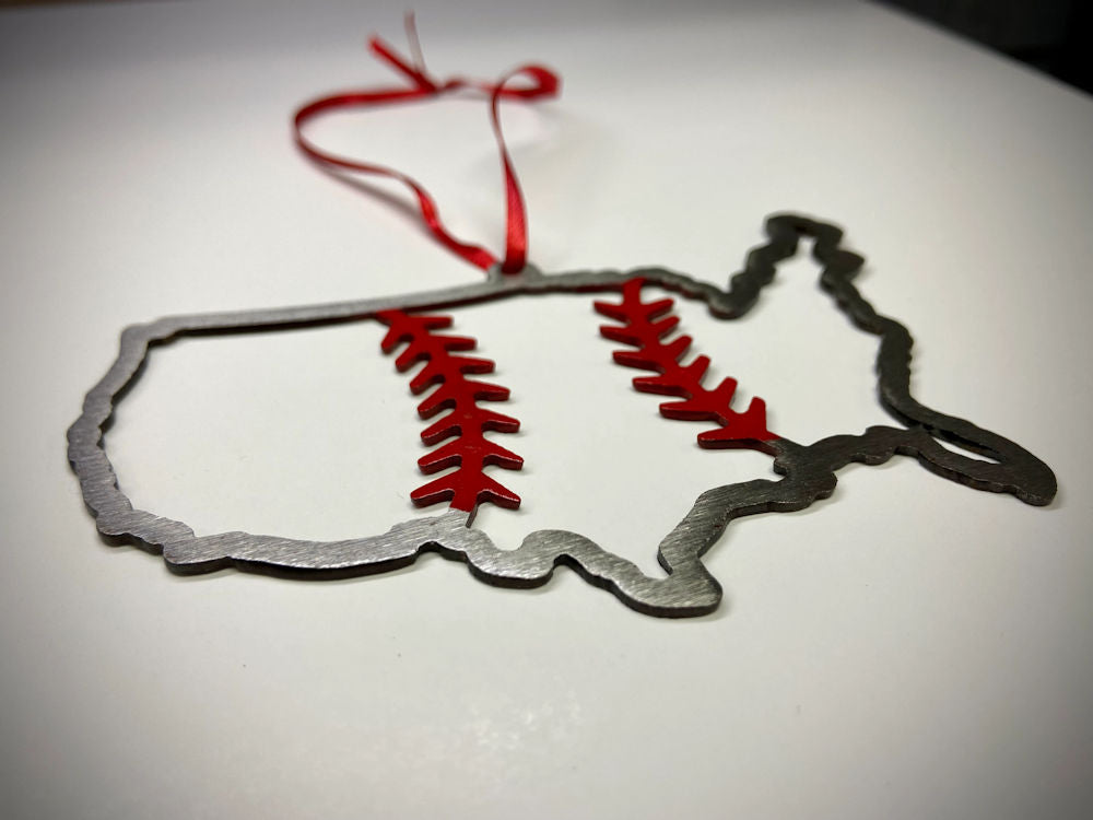 Decorative ornament shaped like a United States outline with red baseball stitch details on a white background