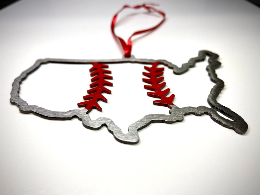 Decorative ornament shaped like a map of the United States with red baseball accents on a white background