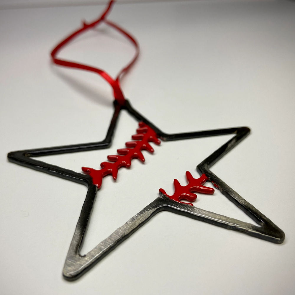 Star-shaped metal baseball ornament with red accents on a white background