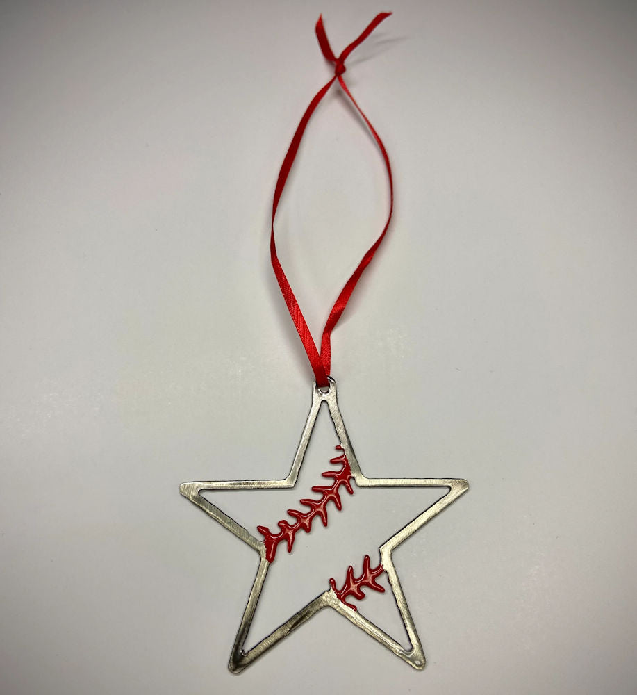 Star-shaped metal baseball ornament with red embroidered design and red ribbon on a light gray background