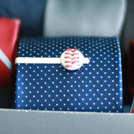 Blue polka dot tie in box with baseball tie clip.