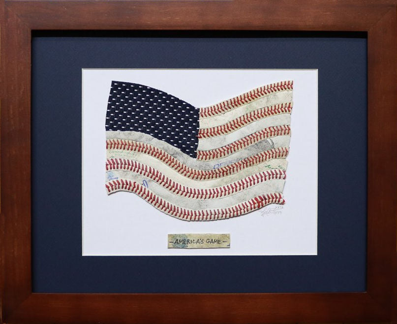Framed artwork of an American flag made from baseballs on a blue background