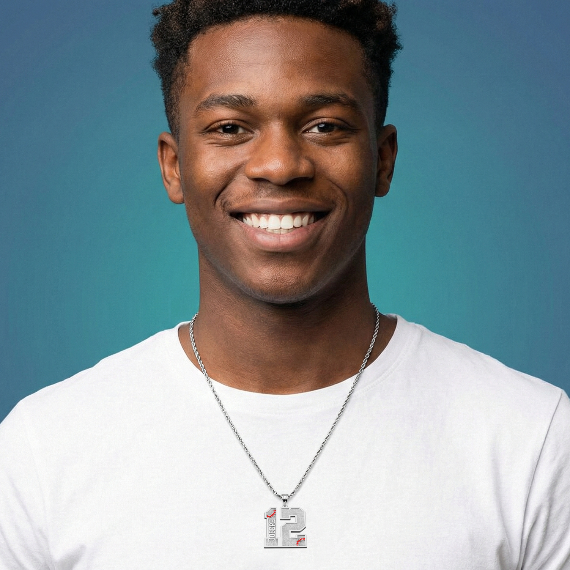 Man wearing a white shirt with a personalized baseball number silver necklace against a blue background