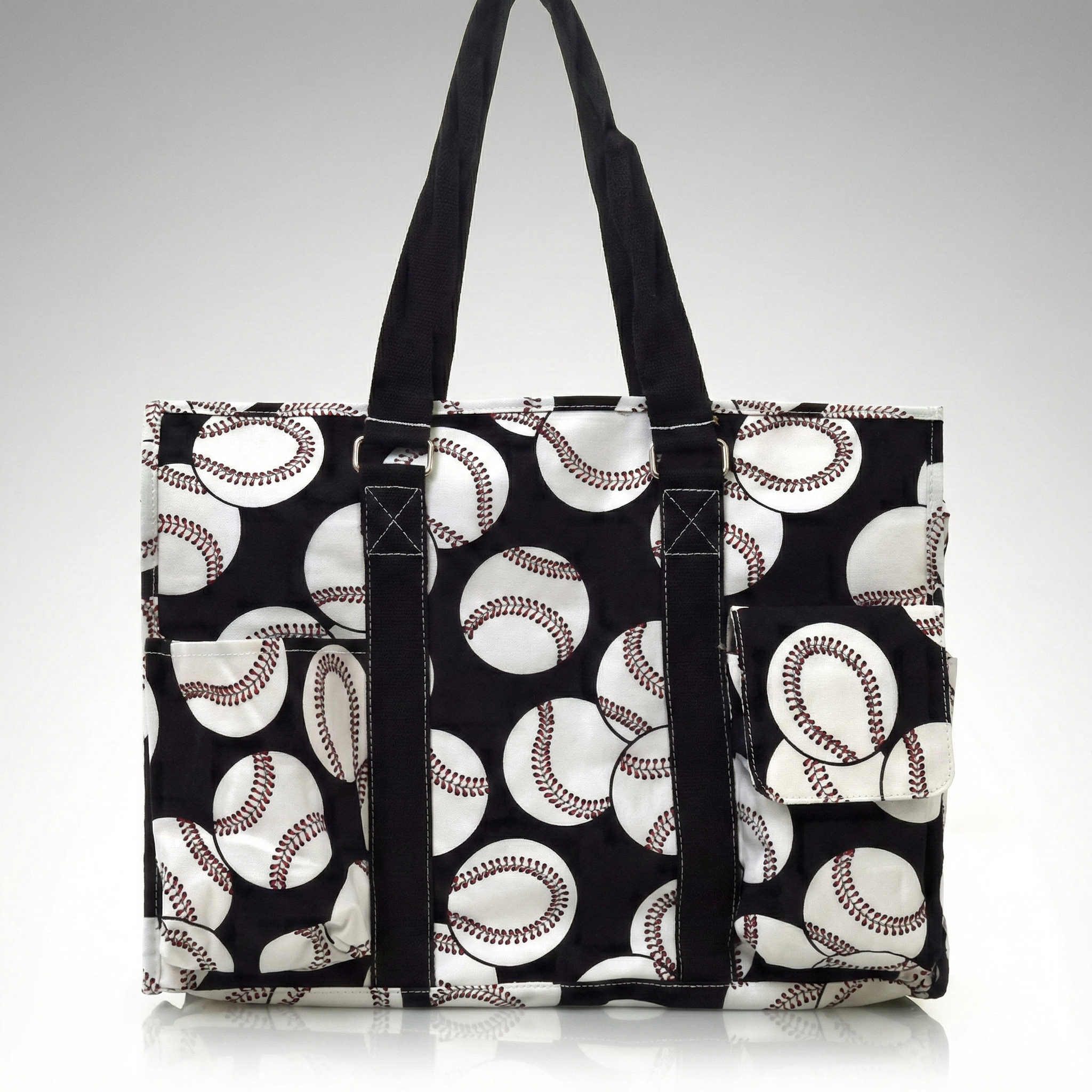 Black tote bag with baseball pattern on a white background