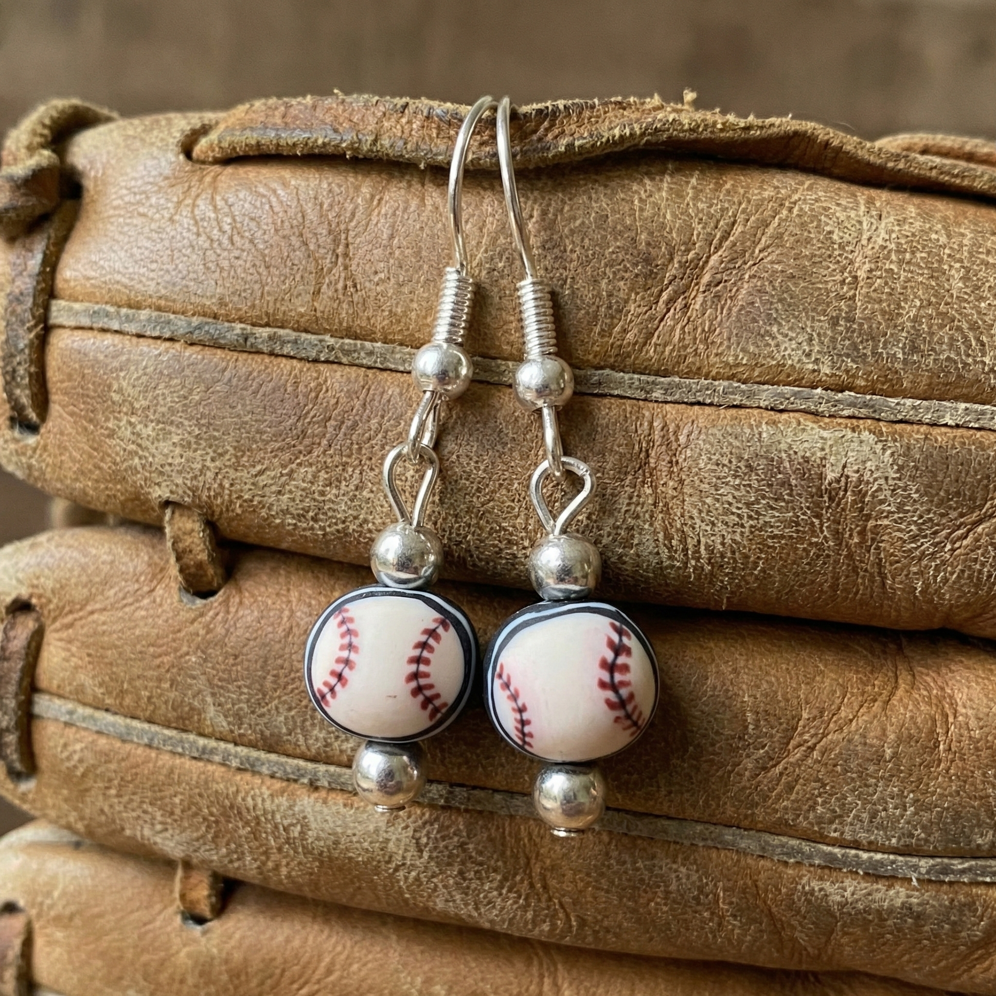 Handmade Clay Baseball Bead Silver Earrings on a mitt
