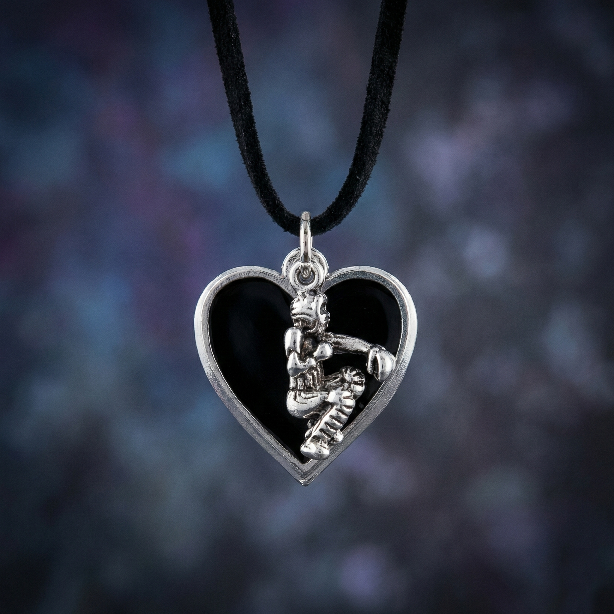 baseball catcher black heart necklace on blurry background