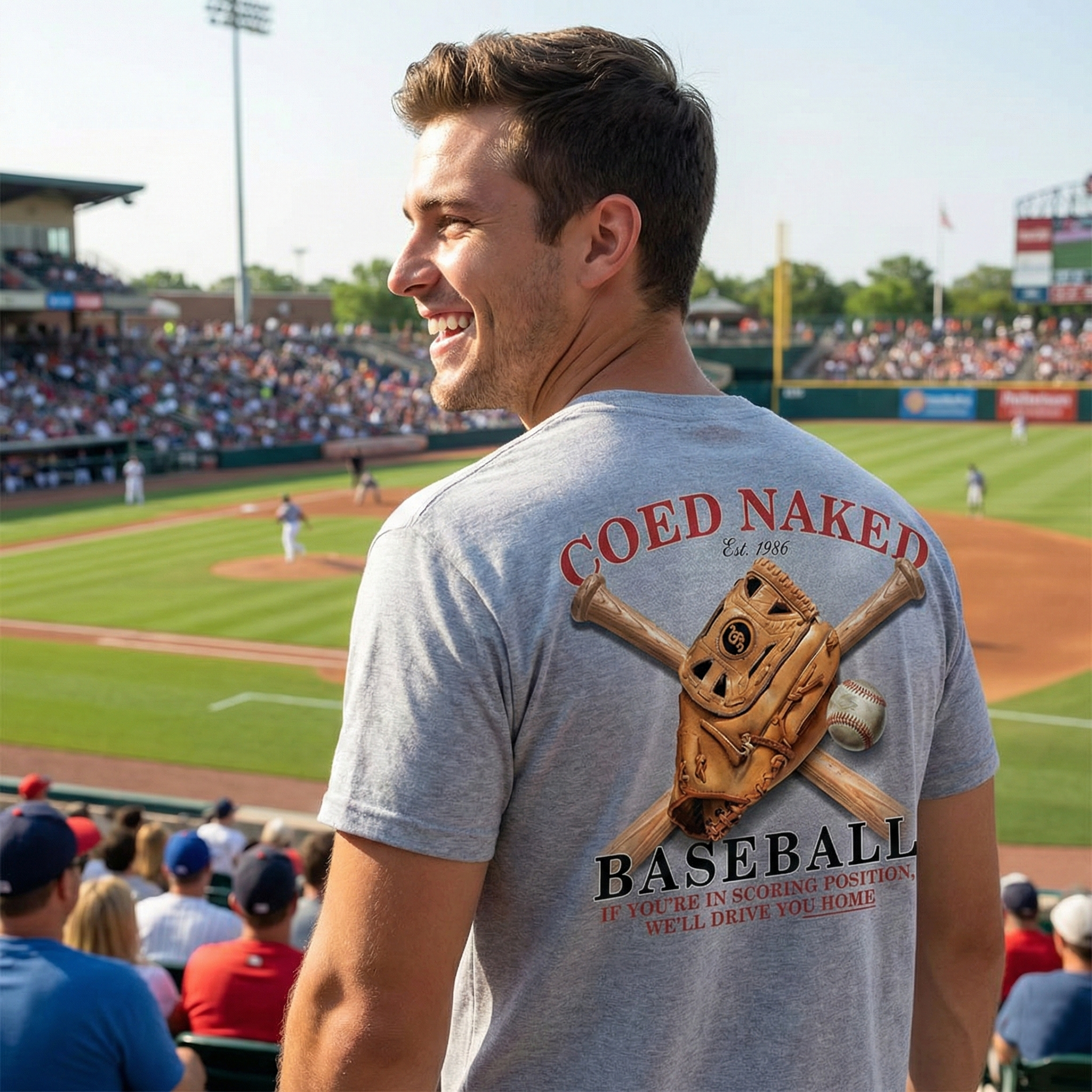 Man wearing a Coed Naked baseball t-shirt with a baseball design at a stadium