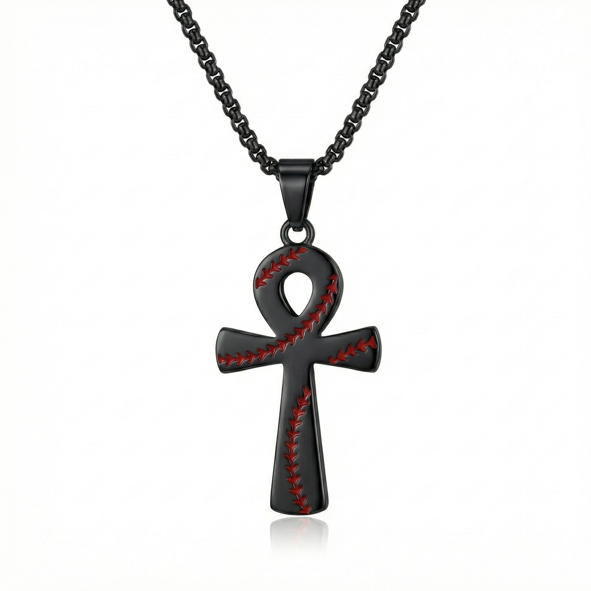 Black cross-shaped pendant with red stitching on a white background