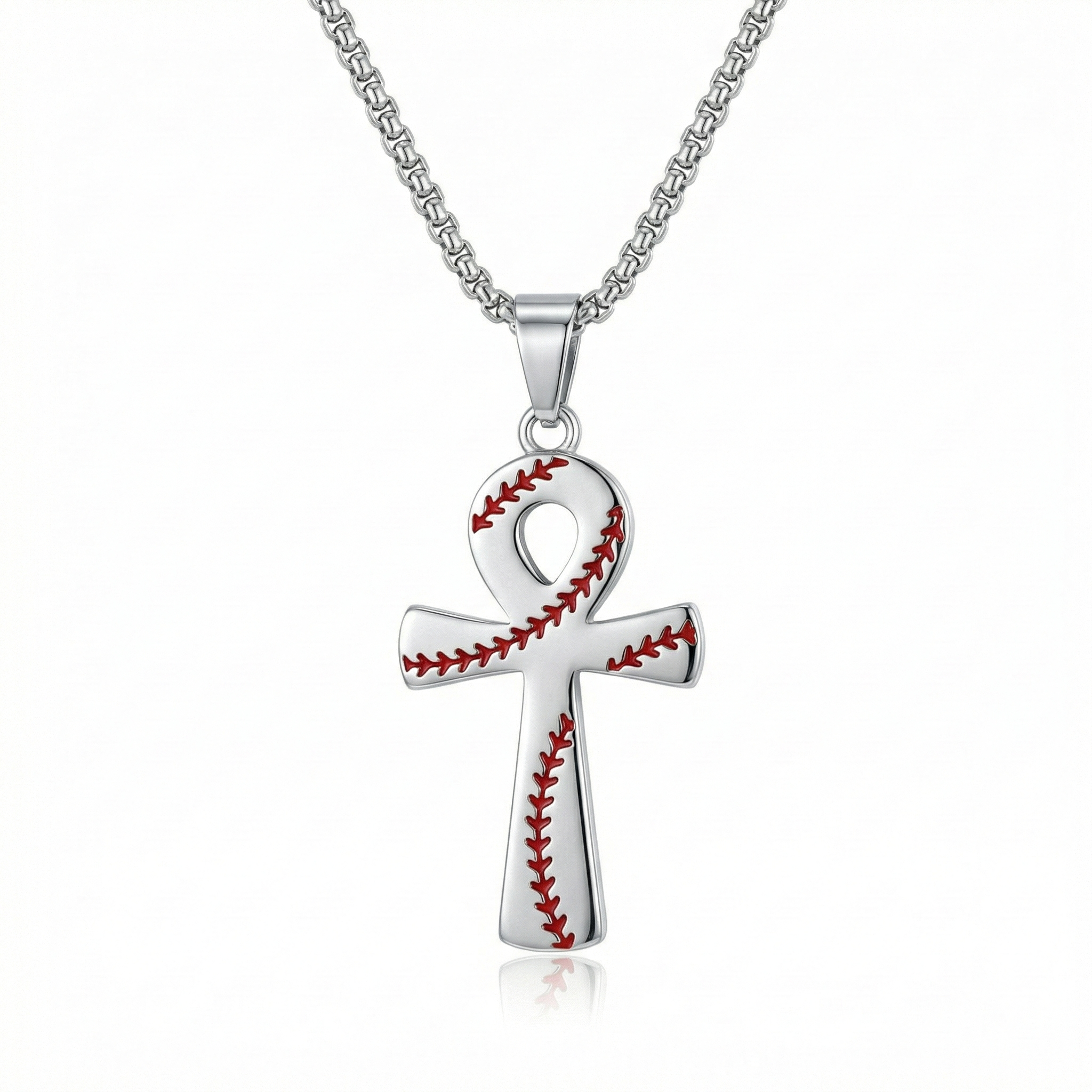 Silver cross pendant with baseball stitching design on a white background