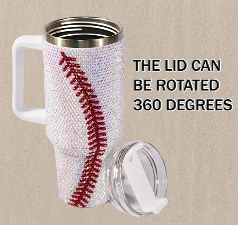 Travel mug with baseball design and rotating lid on a beige background
