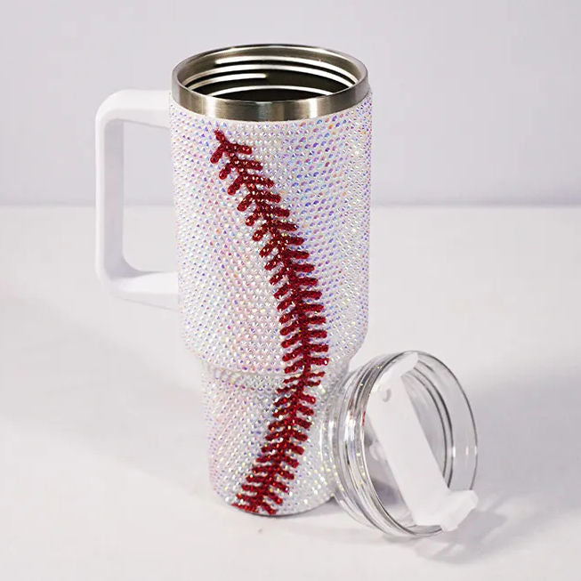 Travel mug with baseball design and clear lid on a white background