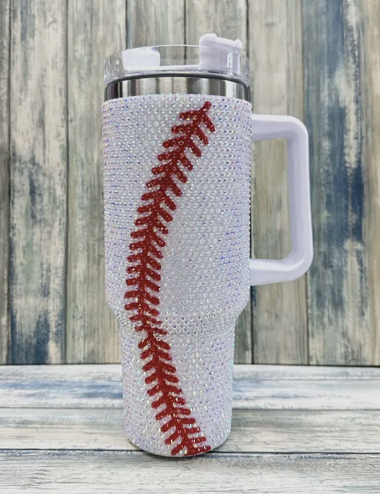 Tumbler with baseball design on a wooden surface