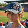 Woman wearing a denim bling cap with a baseball design at a sports event