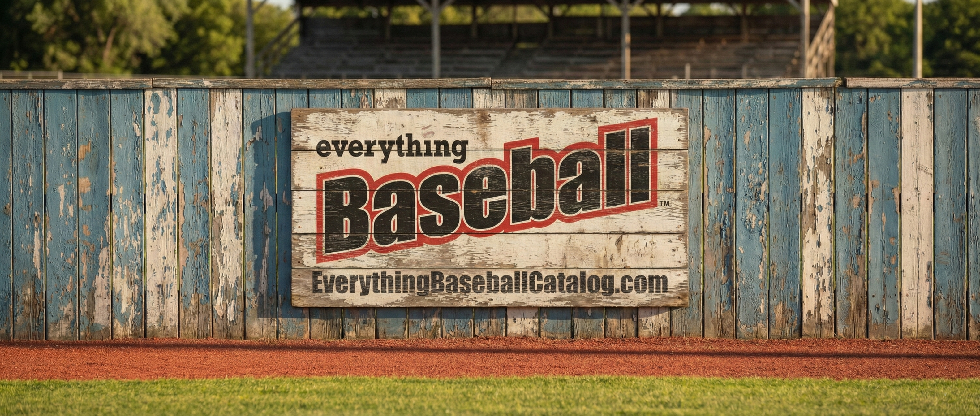 Vintage-style 'Everything Baseball' sign on a wooden fence with a baseball field background.