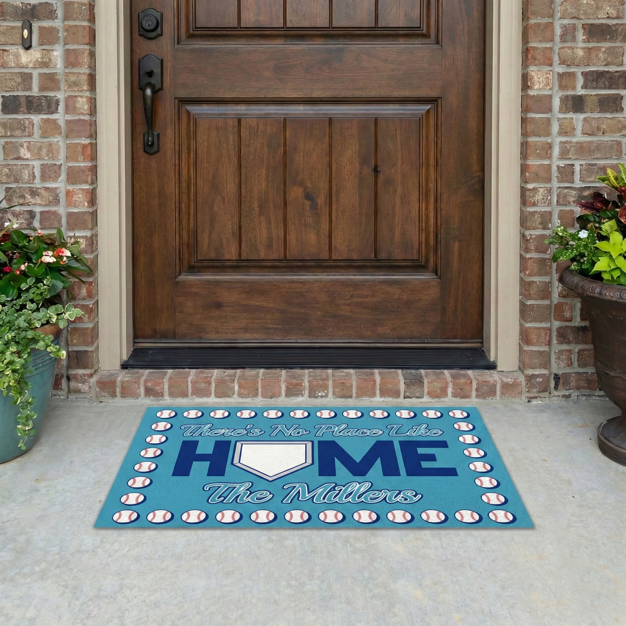 Baseball No Place Like Home doormat with 'Home' and 'The Millers' text in front of a wooden door.