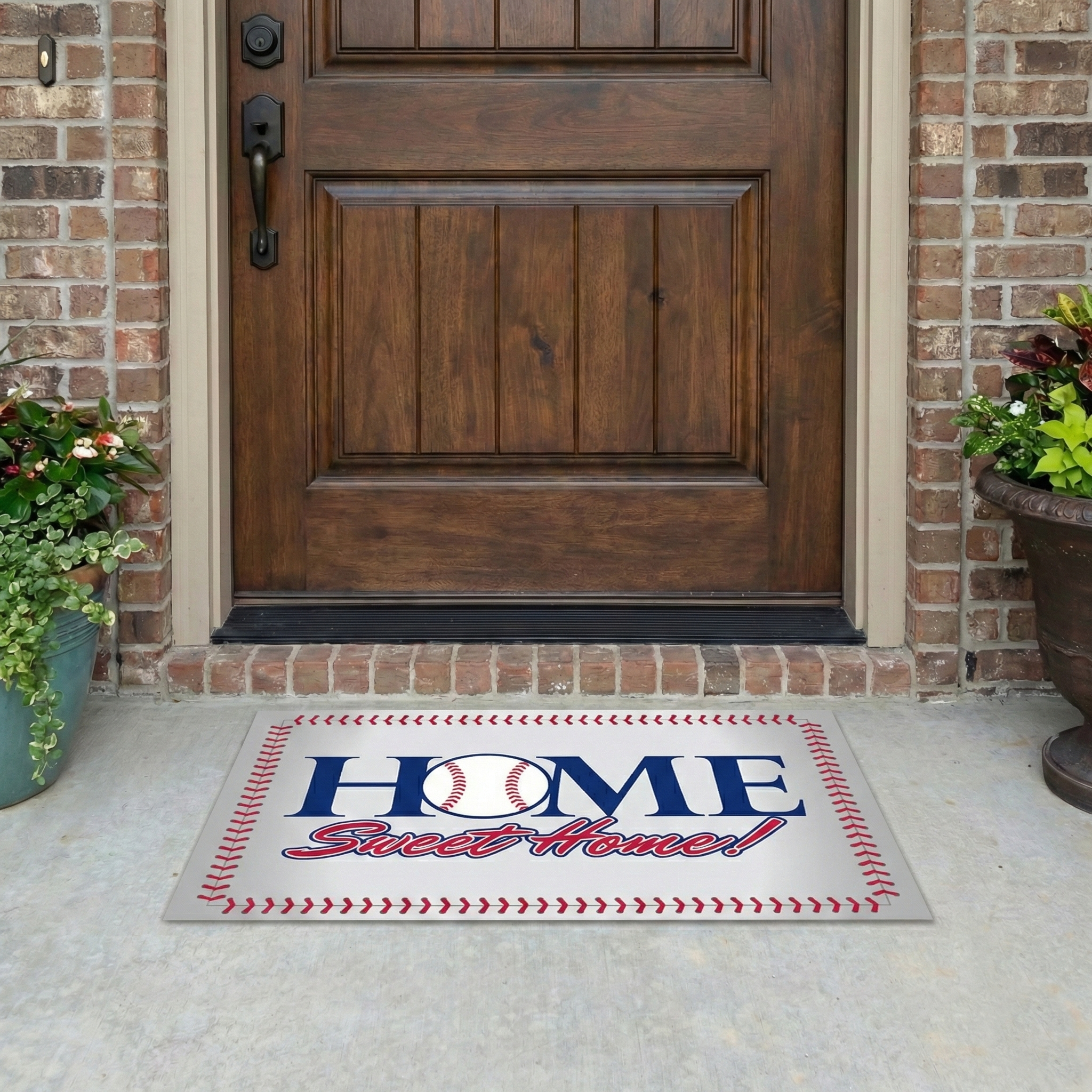 Front door with a 'Home Sweet Home' doormat featuring a baseball design.