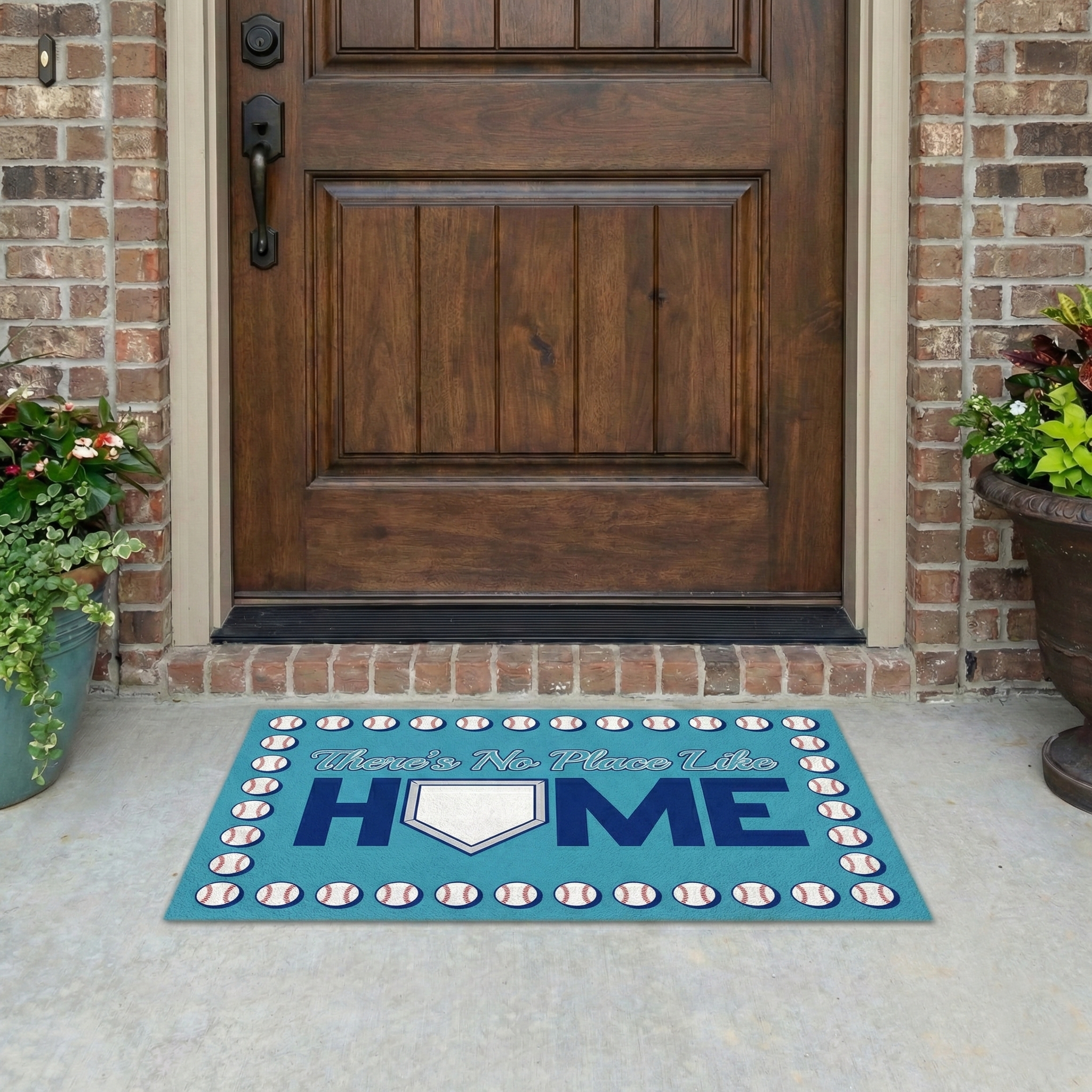 No Place Like Home baseball door mat in front of a wooden door on a porch.