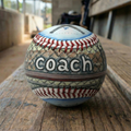 Baseball Coach Gift Baseball on a wooden bench in a baseball dugout