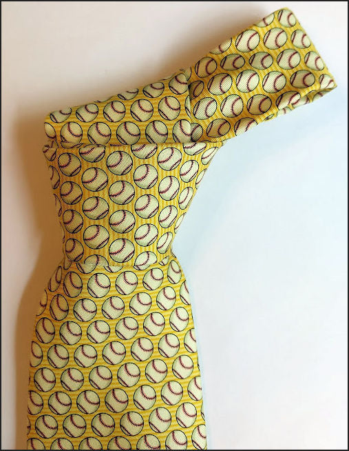 Dress with baseball pattern on a mannequin against a white background