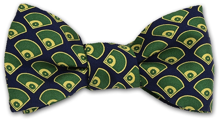 Navy blue bow tie with green and yellow pattern