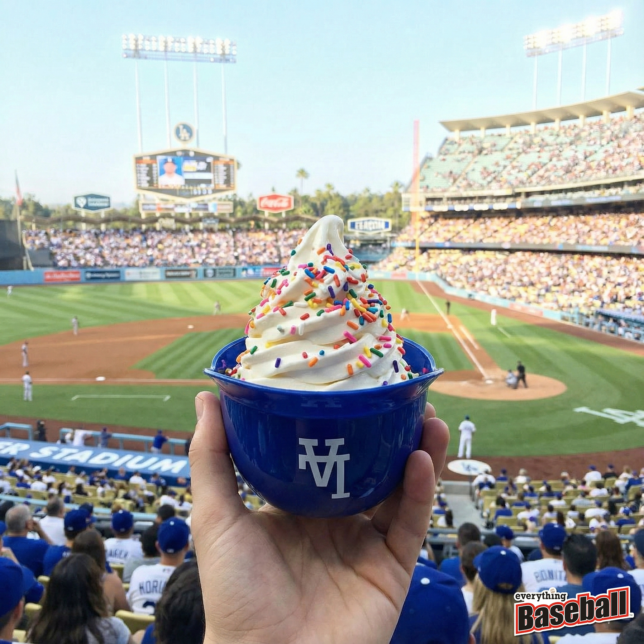 Blue Los Angeles Dodgers helmet bowl with ice cream at a baseball game