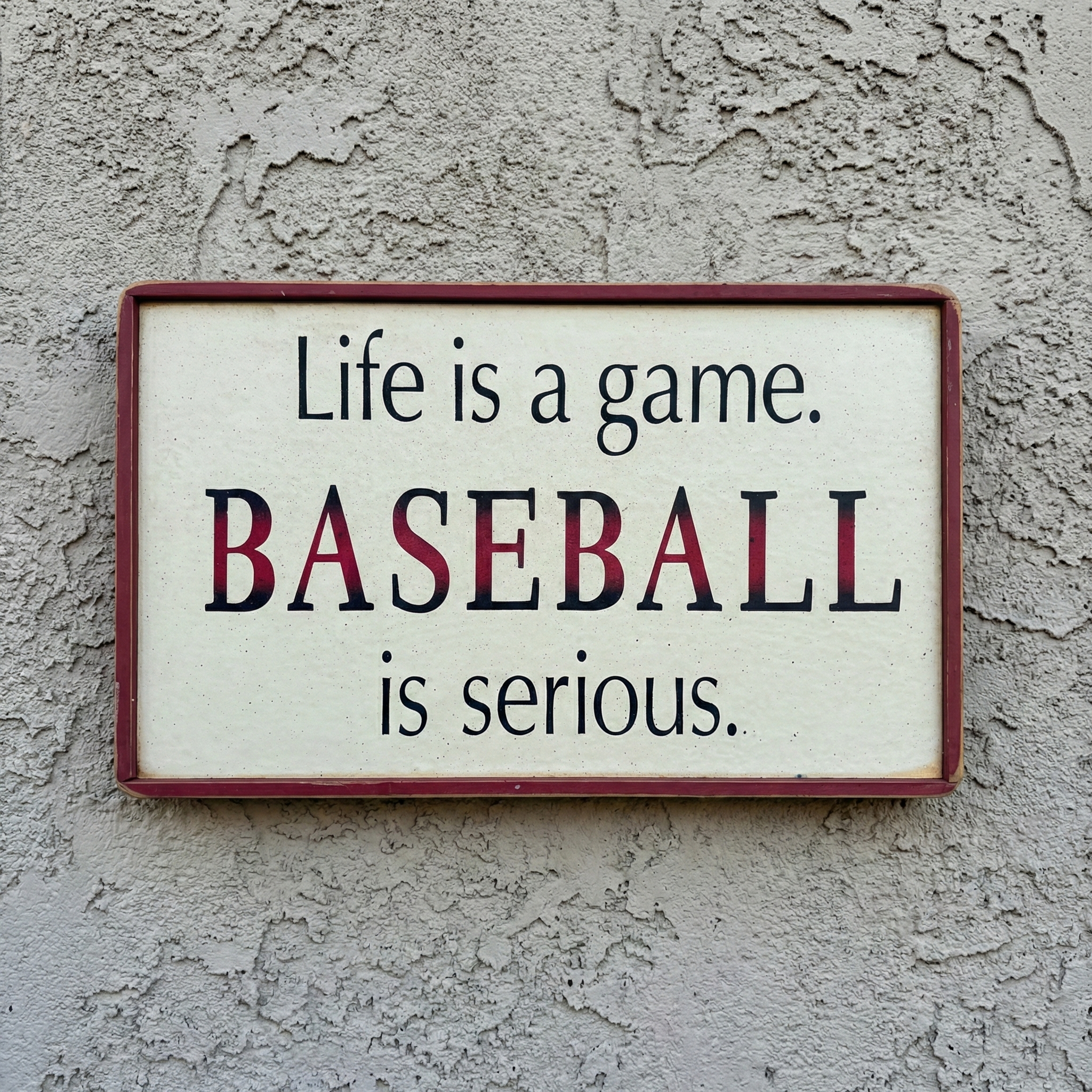Sign with text 'Life is a game. BASEBALL is serious.' on a textured wall.