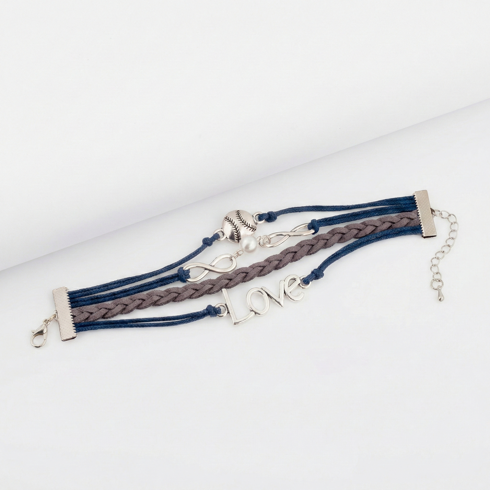baseball wrap bracelet with metal charms on a white background