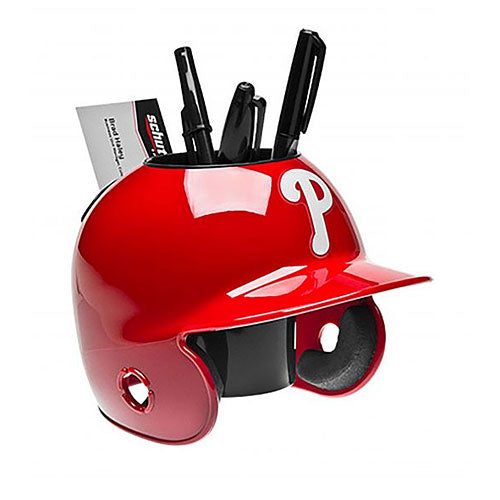 Red Phillies baseball helmet-shaped desk organizer with pens and a card on a white background
