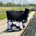 NGIL Baseballs on Black Quilted Diaper Bag on the bleachers at the ball field