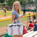 pretty baseball mom with baseball picnic basket at the local youth baseball field