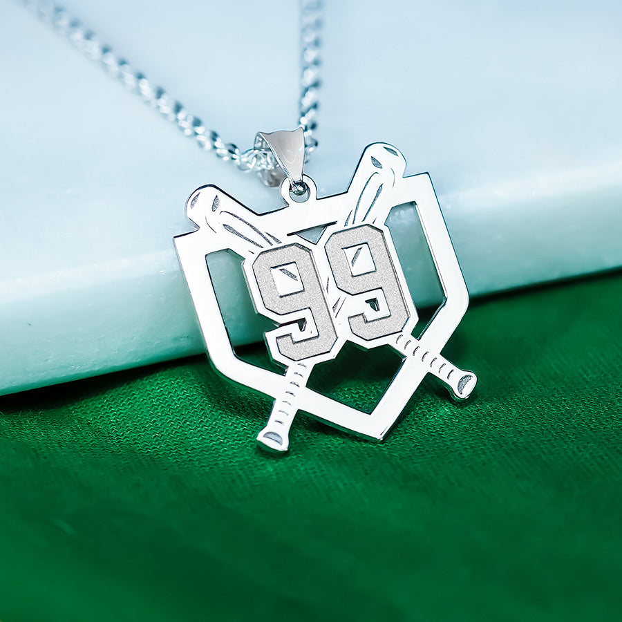 Silver home plate baseball necklace with a pendant featuring the number 99 on a green and white background