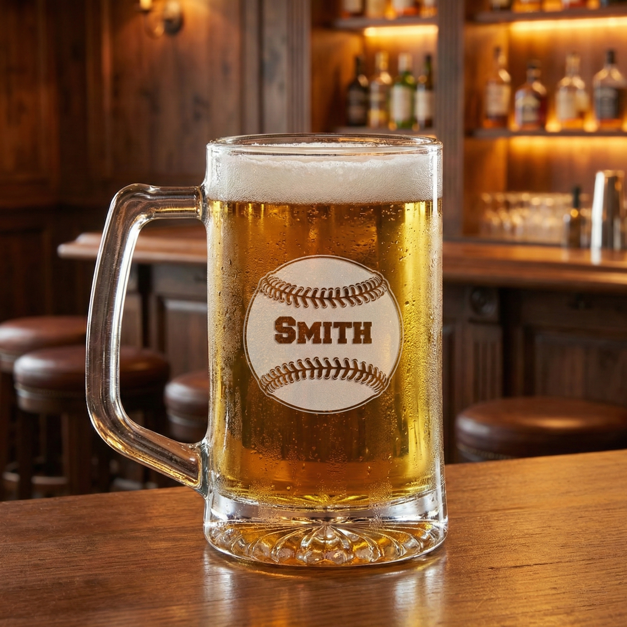 Custom glass mug of cold beer with 'Smith' engraving on a bar background