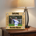 Personalized baseball photo frame on a wooden surface with a lamp in the background