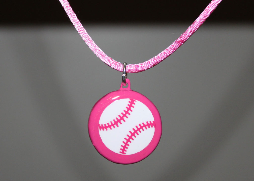 Pink necklace with a baseball pendant on a dark background