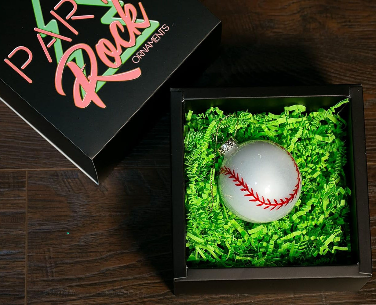 Glass baseball shaped Christmas tree ornament in a gift box.