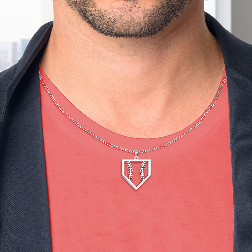 Man wearing a silver necklace with a pendant on a red shirt.