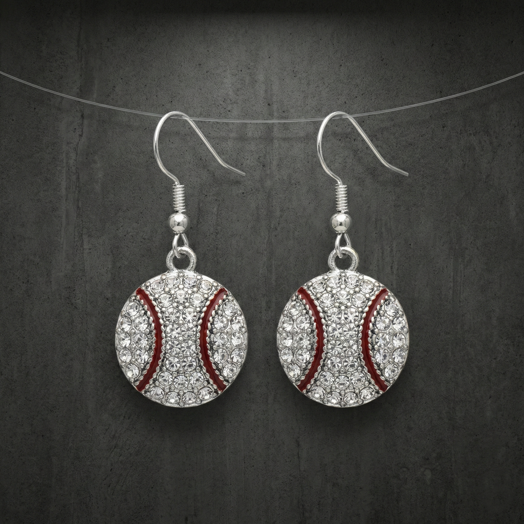 Baseball-themed earrings with crystal embellishments on a dark background