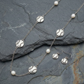 Baseball Long Necklace & Earrings Set displayed on stone. 