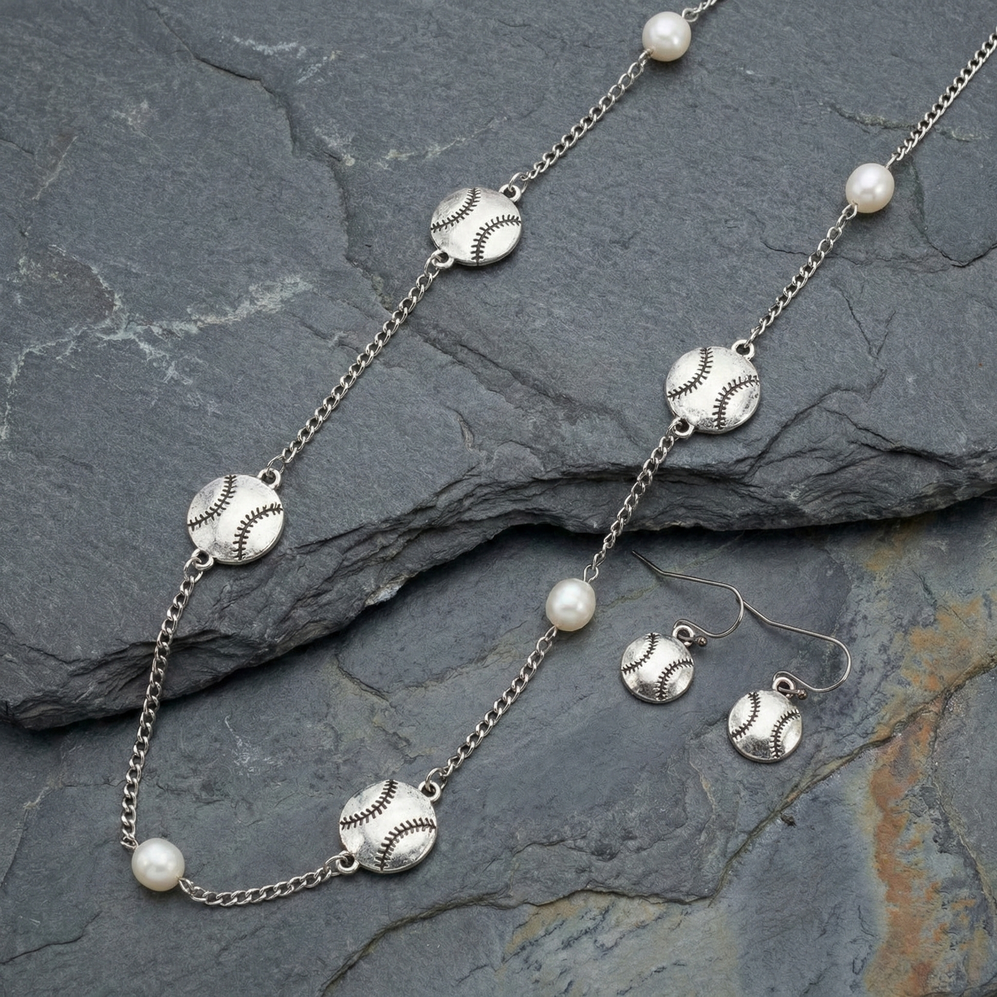 Baseball Long Necklace & Earrings Set displayed on stone. 