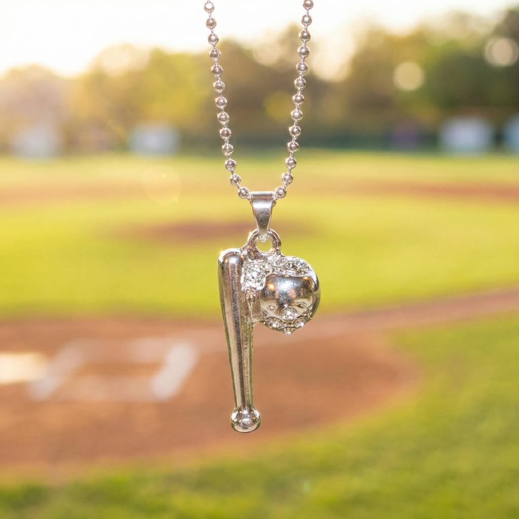 Silver crystal baseball bat and ball necklace with baseball field background